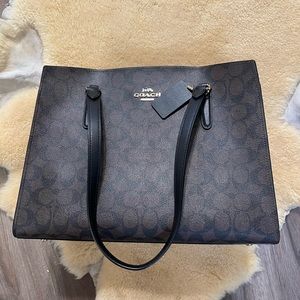 Tatum Carryall in signature Canvas, Black/Brown with Red interior.